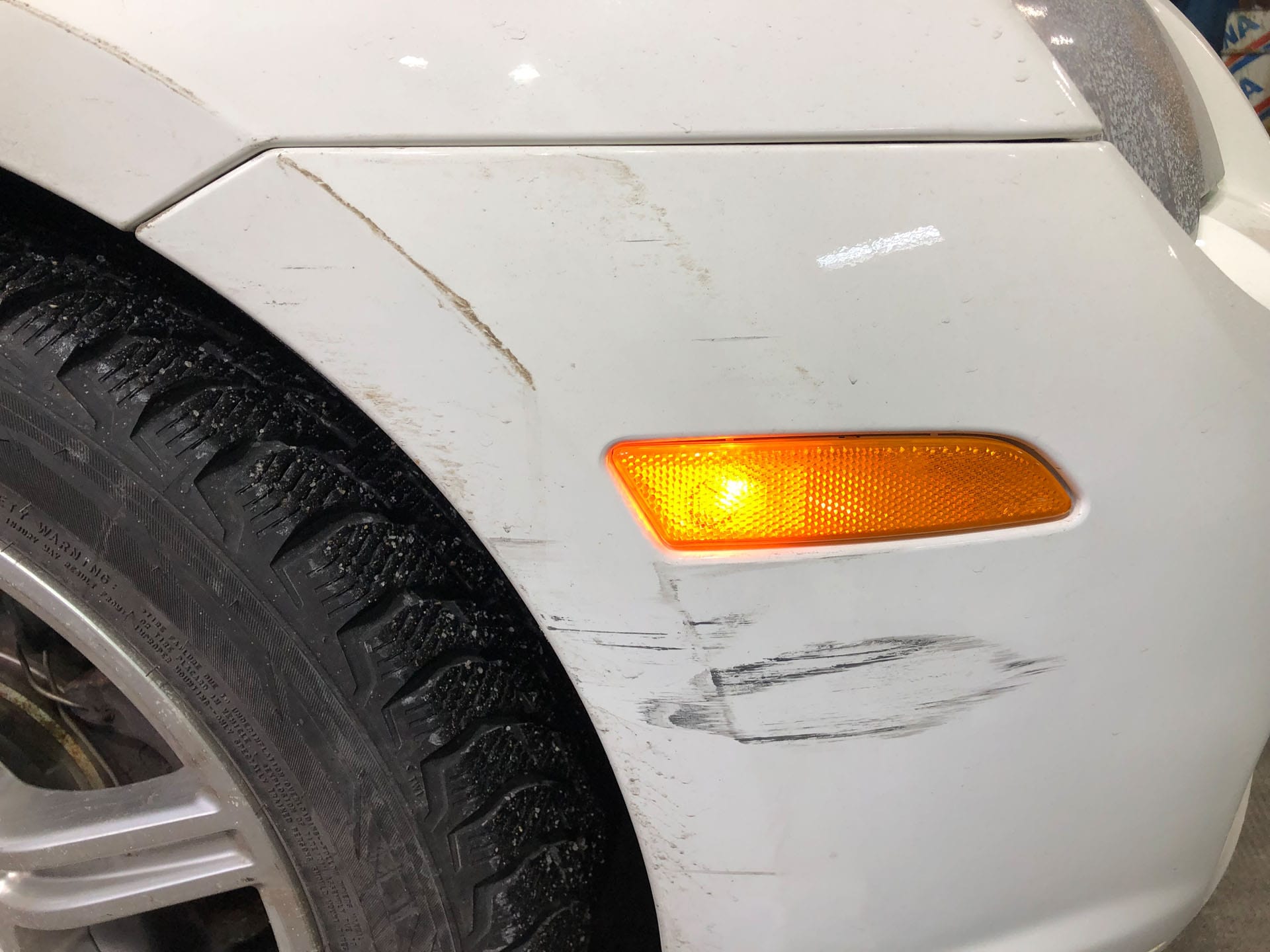 Scratched white car